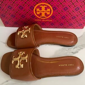 Tory Burch Eleanor Slide in Bourbon and Gold and new with tags.
